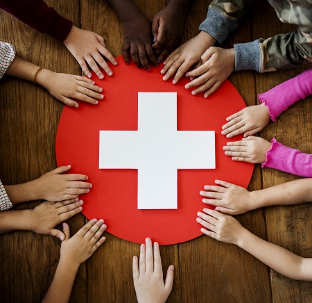 Children Holding a Red Cross
